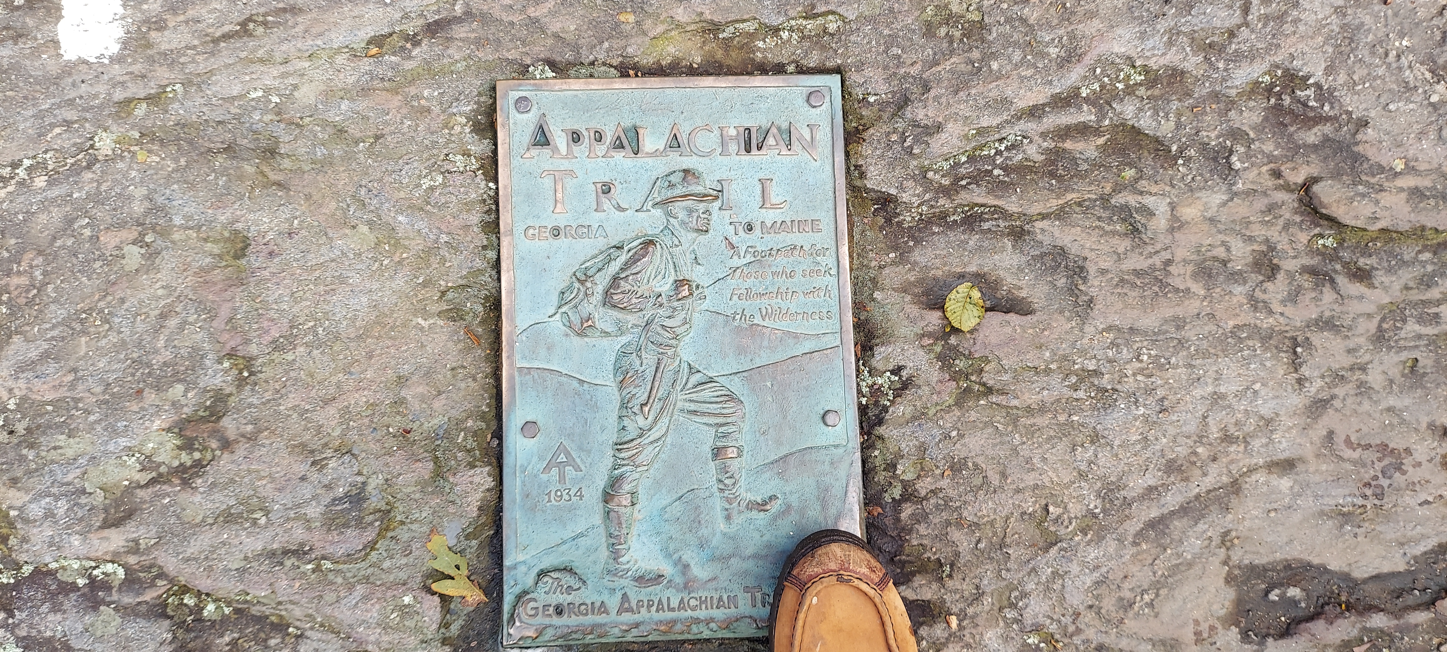Eric touching the Southern AT plaque with boot
